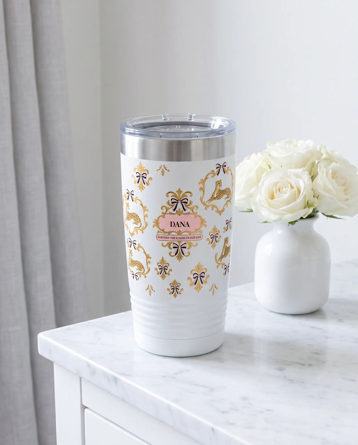 Cheetah Damask, Pickup Line wrap on a white 20oz tumbler personalized DANA, a marble vanity top in a softly lit dressing room