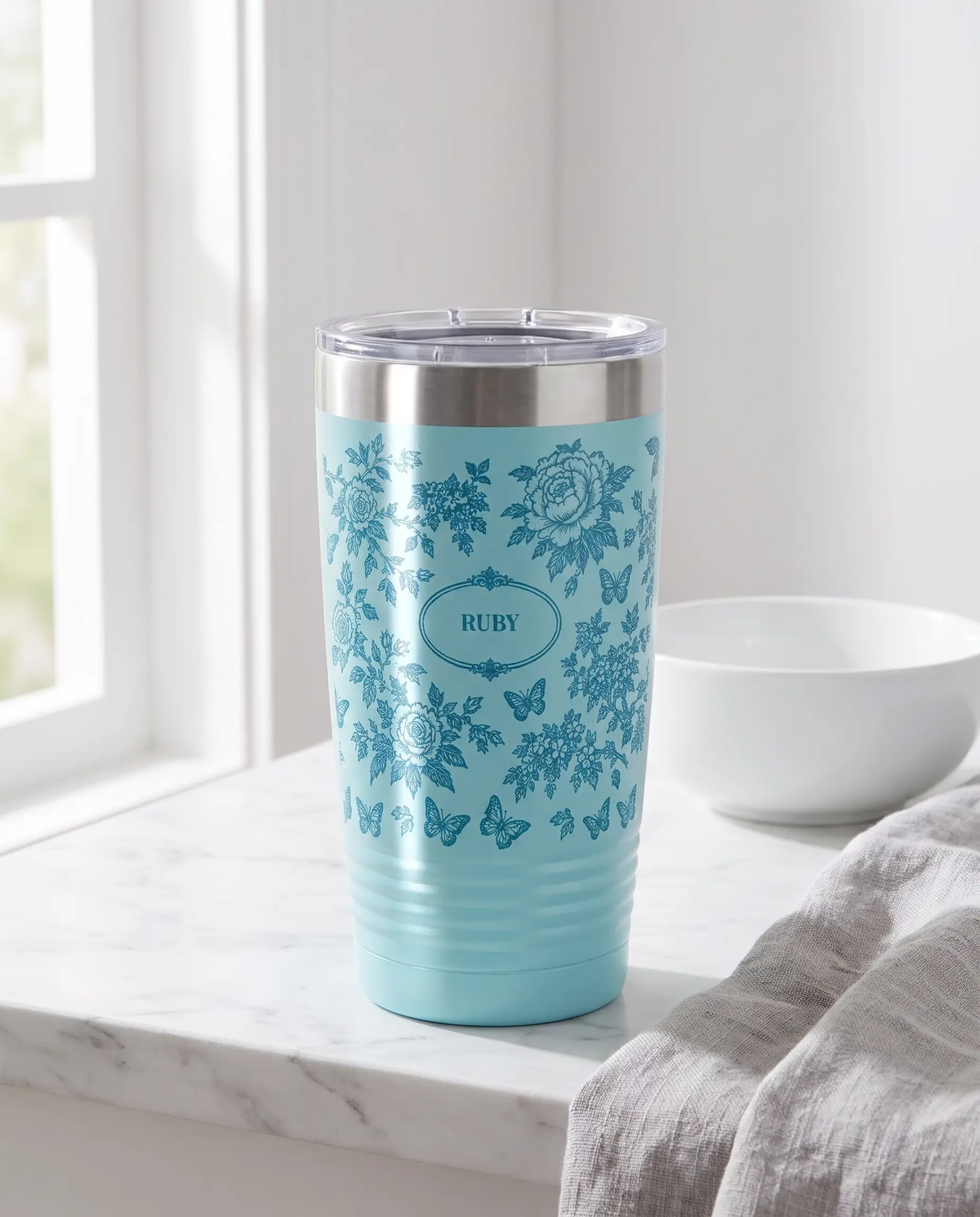Botanical Toile, Tone on Tone wrap on a light blue 20oz tumbler personalized RUBY, a farmhouse kitchen counter of white marble