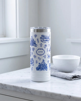 Modern Mom Toile wrap on a white 22oz Skinny tumbler personalized LAINEY, a farmhouse kitchen counter of white marble