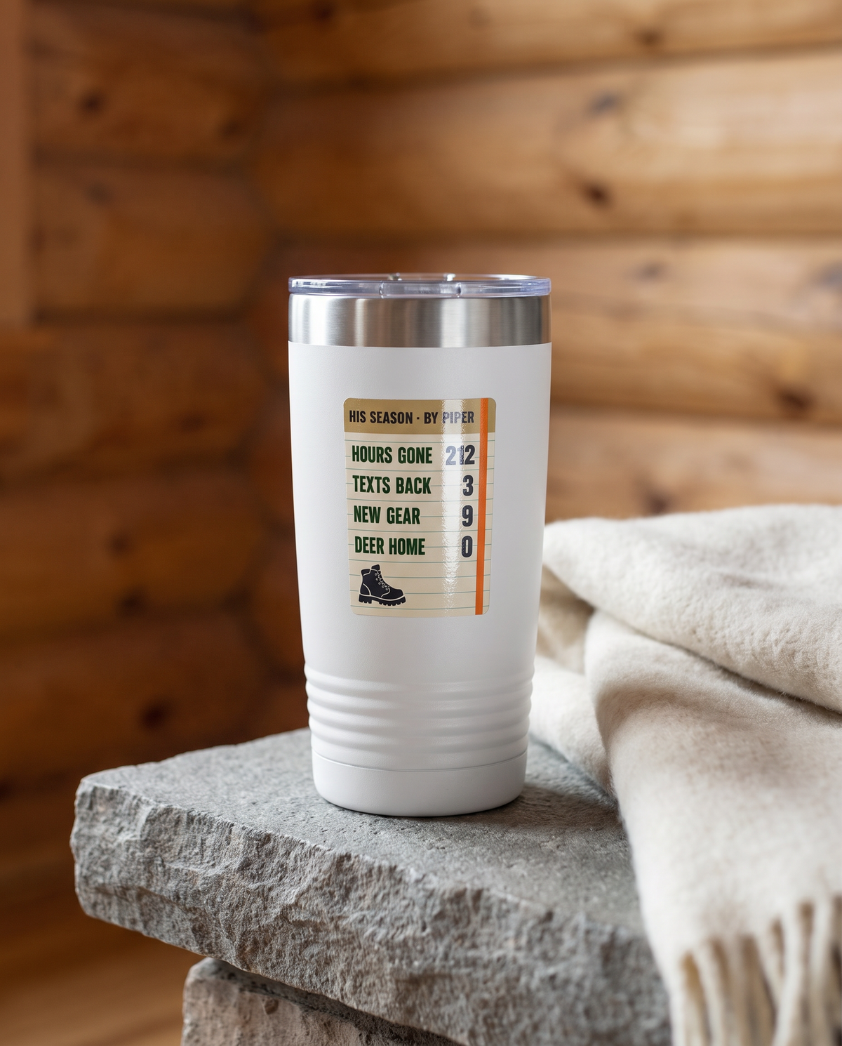 Season Log, His Season badge on a white 20oz tumbler personalized HIS SEASON - BY PIPER, a stone hearth ledge in a log cabin