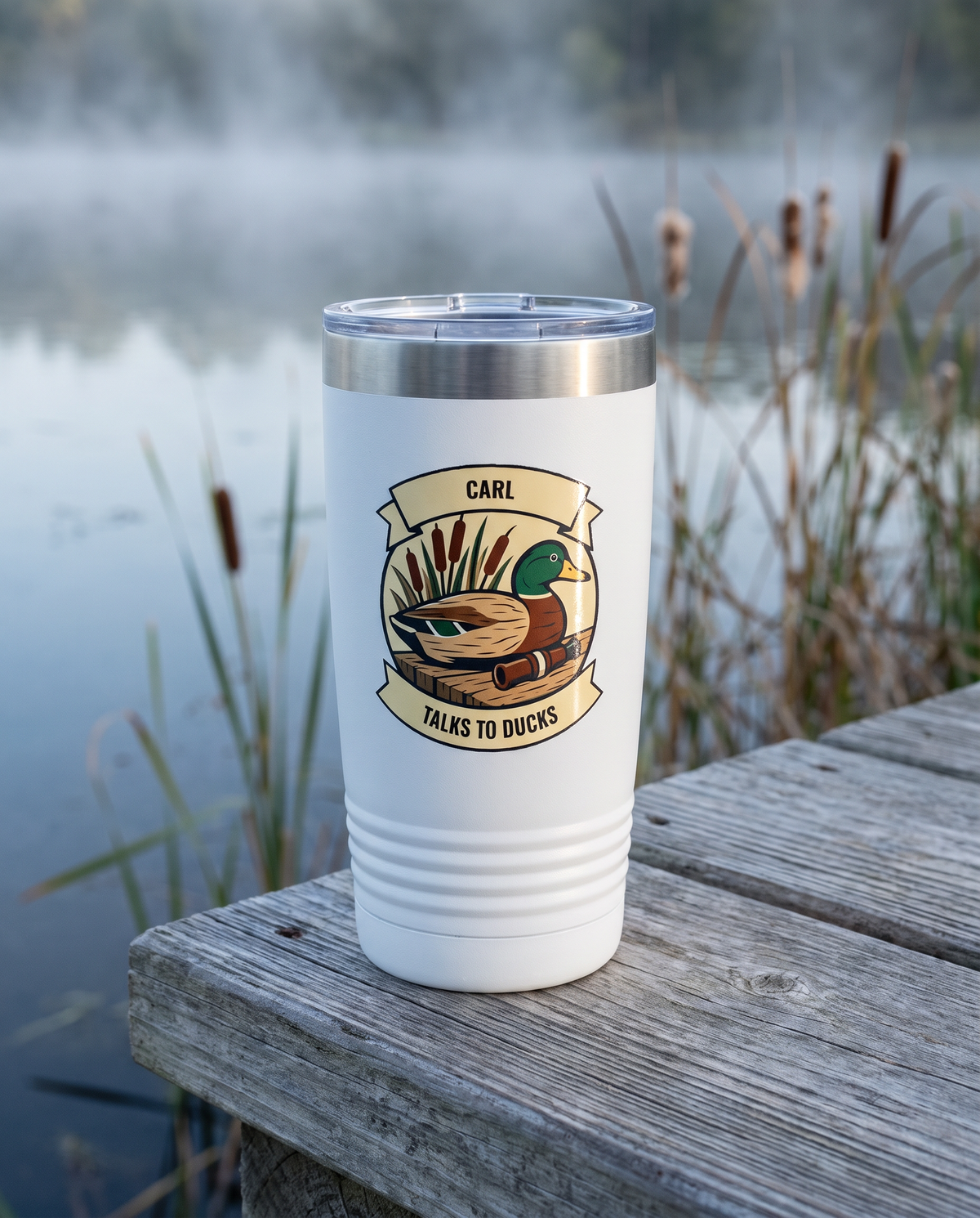 Duck Blind, Talks to Ducks badge on a white 20oz tumbler personalized CARL, TALKS TO DUCKS, a weathered wooden dock over a misty marsh