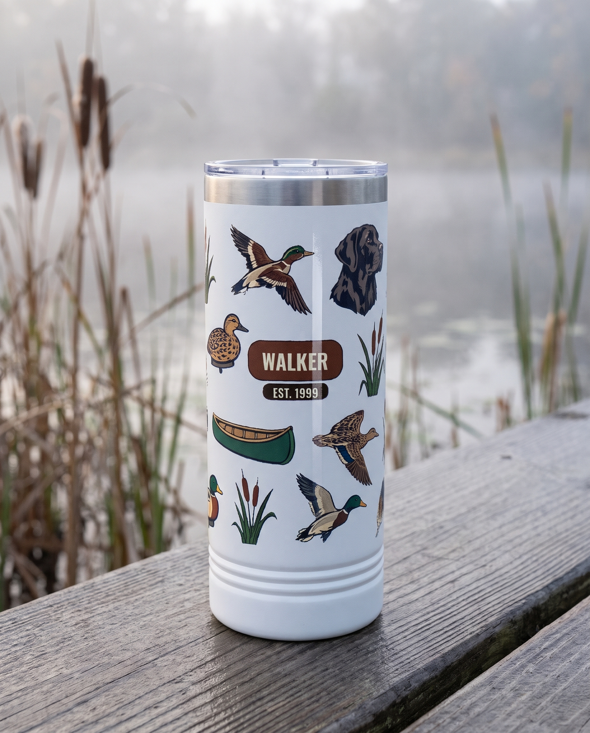 Duck Blind, Est. Year wrap on a white 22oz Skinny tumbler personalized WALKER, EST. 1999, a weathered wooden dock over a misty marsh