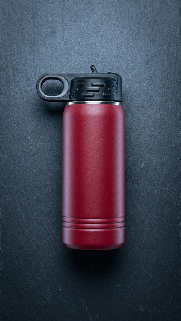Hand-held Maroon Polar Camel 12Oz Water Bottle in a Pomelli setting