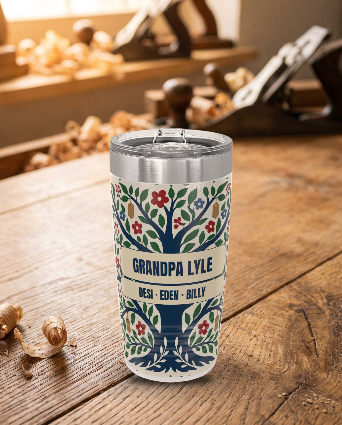 Family Tree, a folk family tree in navy, green, red, blue and tan on cream, printed all the way around a 20oz Ringneck tumbler in White, sample name GRANDPA LYLE