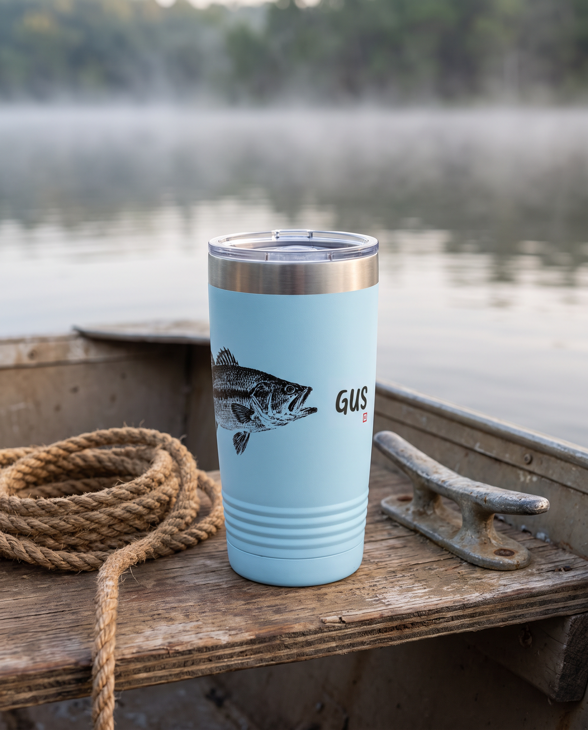 Gyotaku Bass personalized fishing tumbler on a jon boat bench on a misty lake, name GUS