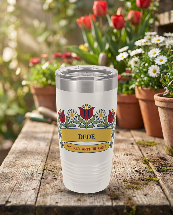 Tulip Garden Arch, folk tulips and daisies in red, cream, gold and sage, outlined in navy, UV printed on the front of a 20oz Ringneck tumbler in White, sample name DEDE