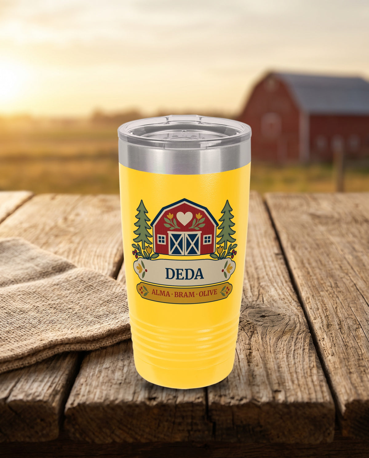 Heart Barn, a red barn and pines in red, cream, gold, navy and sage, UV printed on the front of a 20oz Ringneck tumbler in Yellow, sample name DEDA