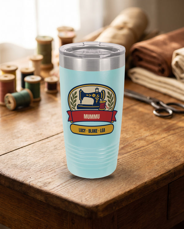 Sewing Machine Badge, a sewing badge in navy, red, cream, gold and olive, UV printed on the front of a 20oz Ringneck tumbler in Light Blue, sample name MUMMU