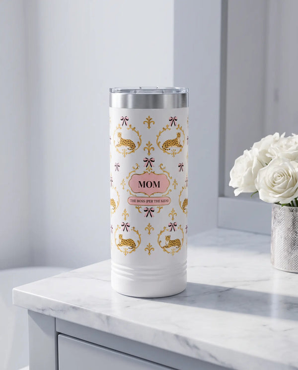 Cheetah Damask, The Boss wrap on a white 22oz Skinny tumbler personalized MOM, a marble vanity top in a softly lit dressing room