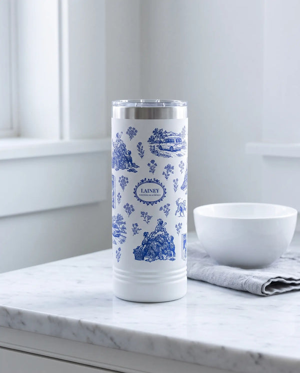 Modern Mom Toile wrap on a white 22oz Skinny tumbler personalized LAINEY, a farmhouse kitchen counter of white marble