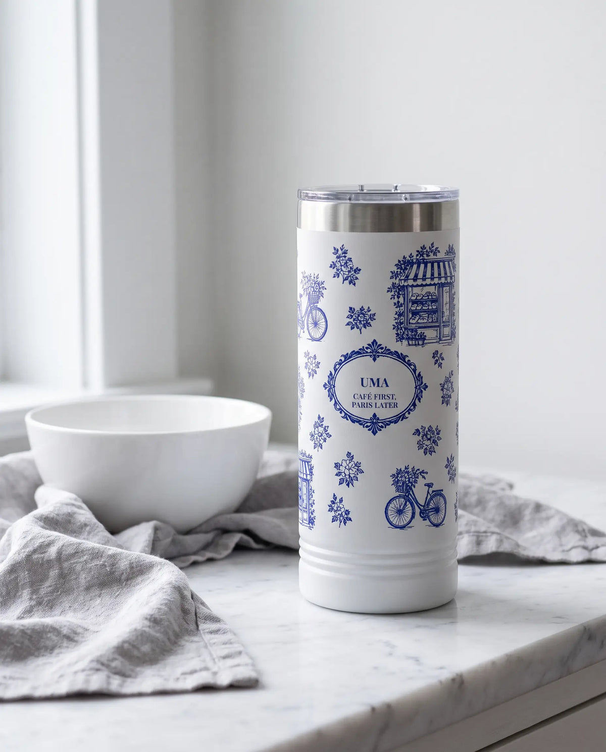 Paris Toile wrap on a white 22oz Skinny tumbler personalized UMA, a farmhouse kitchen counter of white marble