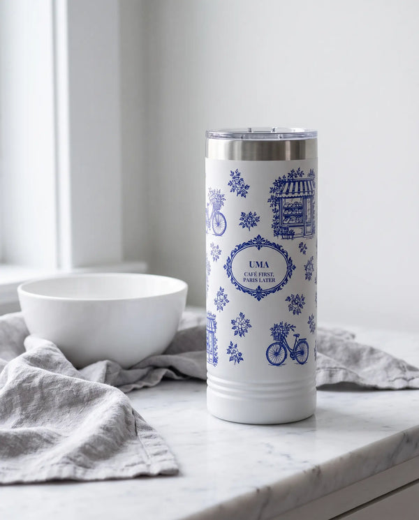 Paris Toile wrap on a white 22oz Skinny tumbler personalized UMA, a farmhouse kitchen counter of white marble