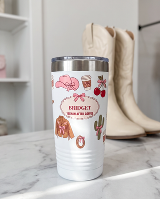 Coquette Cowgirl, Yeehaw After Coffee wrap on a white 20oz tumbler personalized BRIDGET, YEEHAW AFTER COFFEE, a white marble vanity top in a bright boutique