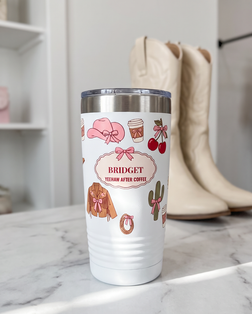 Coquette Cowgirl, Yeehaw After Coffee wrap on a white 20oz tumbler personalized BRIDGET, YEEHAW AFTER COFFEE, a white marble vanity top in a bright boutique
