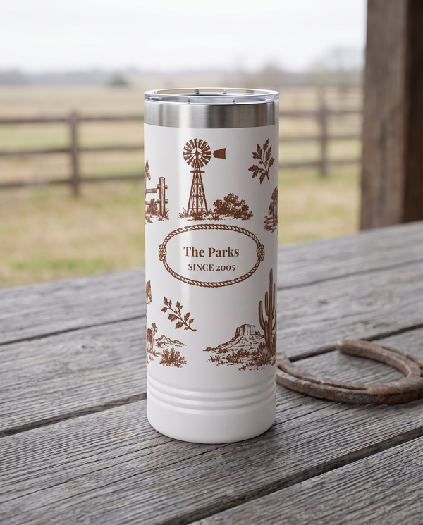 Western Toile, Windmill and Barn wrap on a white 22oz Skinny tumbler personalized THE PARKS, SINCE 2005, a weathered barnwood table on a ranch porch