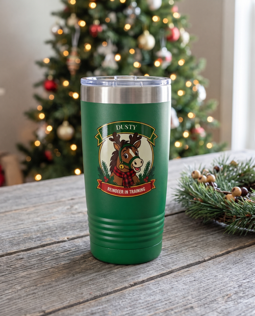 Cowboy Christmas, Reindeer in Training badge on a green 20oz tumbler personalized DUSTY, REINDEER IN TRAINING, a barnwood table in a farmhouse at Christmas