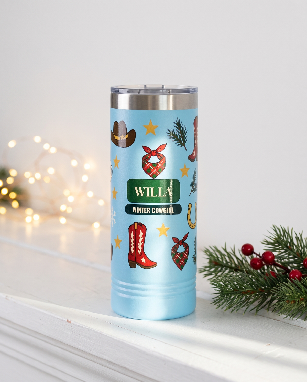 Cowboy Winter, Winter Cowgirl wrap on a light blue 22oz Skinny tumbler personalized WILLA, WINTER COWGIRL, a white-painted ranch-house mantel at Christmas