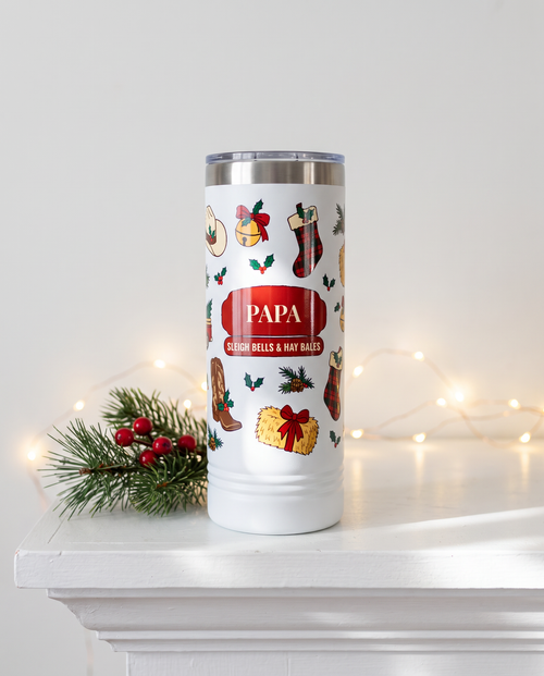 Cowboy Christmas, Sleigh Bells & Hay Bales wrap on a white 22oz Skinny tumbler personalized PAPA, SLEIGH BELLS & HAY BALES, a white-painted ranch-house mantel at Christmas