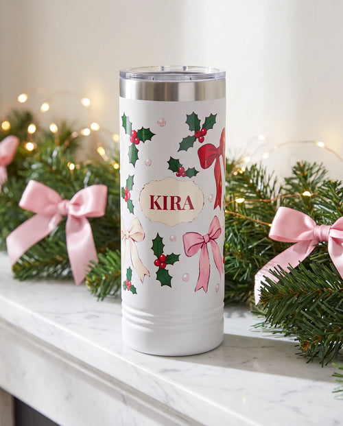 Bows and Holly Skinny on a white 22oz skinny tumbler, UV printed by Karved