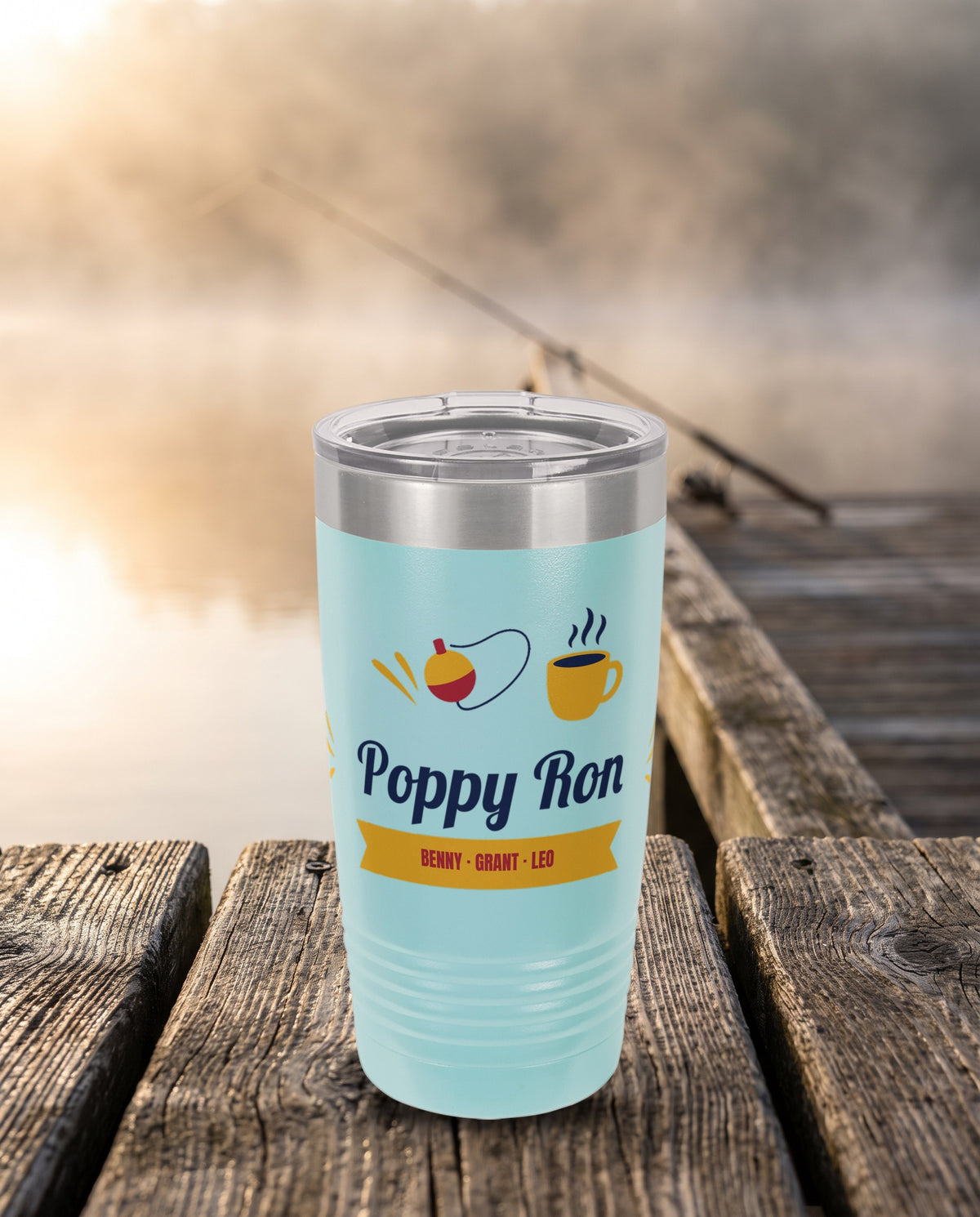 Bobber and Coffee Script, a fishing bobber, coffee cup and gold ribbon around a script name, UV printed on the front of a 20oz Ringneck tumbler in Light Blue, sample name Poppy Ron