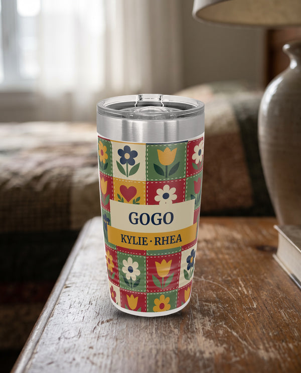 Patchwork Quilt, a folk patchwork quilt in red, green, gold, cream and navy, printed all the way around a 20oz Ringneck tumbler in White, sample name GOGO