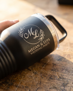 20oz Travel Mug with a custom laser-engraved logo, close-up of the decoration | Karved Concepts