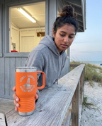 20oz Travel Mug with a custom laser-engraved logo, lifestyle photo 1 | Karved Concepts