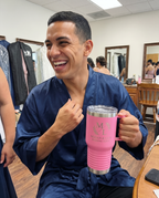 20oz Travel Mug with a custom laser-engraved logo, lifestyle photo 2 | Karved Concepts