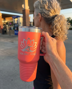 40oz Travel Mug with a custom laser-engraved logo, in hand to show size | Karved Concepts