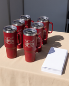 40oz Travel Mug with a custom laser-engraved logo, set out for a company event | Karved Concepts