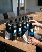 32oz Water Bottle, UV printed with a sample business logo (illustrative image of a bulk order)