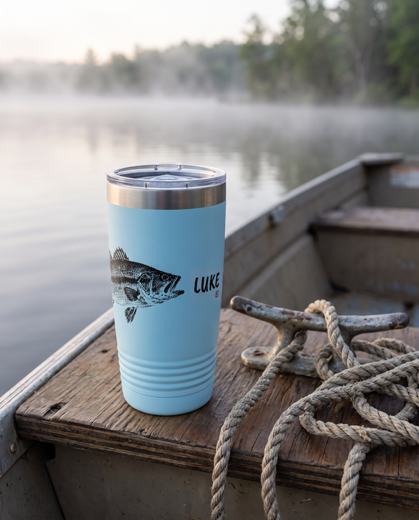 Gyotaku Bass personalized fishing tumbler on a boat bench with a coiled rope, name LUKE