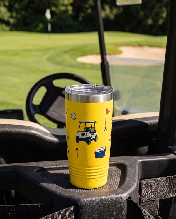 Bag Drop Cart personalized golf tumbler in yellow on a golf cart dash beside the green, name ROSA
