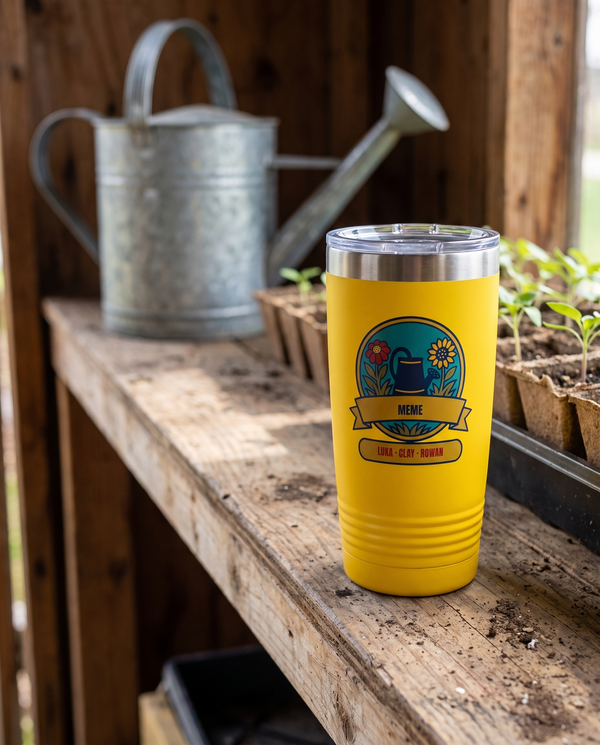 Watering Can Badge, a garden badge in teal, navy, red, gold and olive, UV printed on the front of a 20oz Ringneck tumbler in Yellow, sample name MEME, sits on a garden shed shelf of weathered wood, a galvanized watering can and seedlings far behind