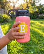 12oz Water Bottle, held in a child's hand to show its size | Karved Concepts