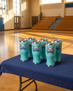 20oz Pilsner Tumbler with a custom full-color printed logo, set out for a company event | Karved Concepts