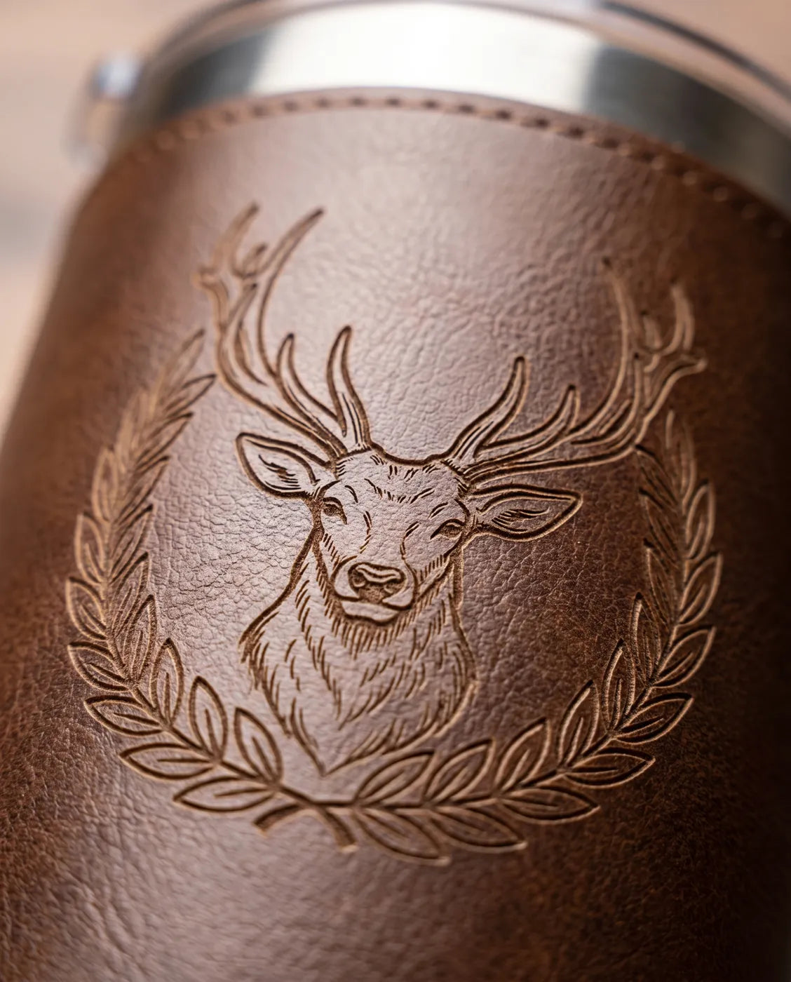 Laser engraved design on a leatherette tumbler wrap