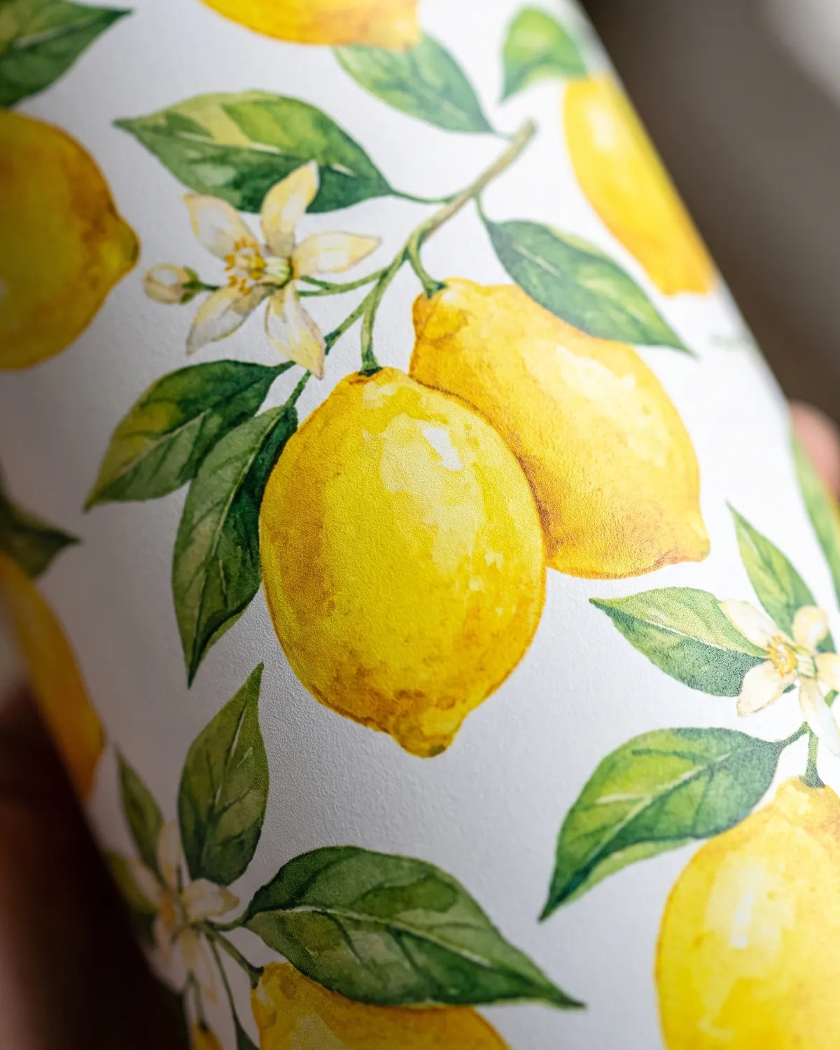 Close-up of a full-color lemon print on a skinny tumbler