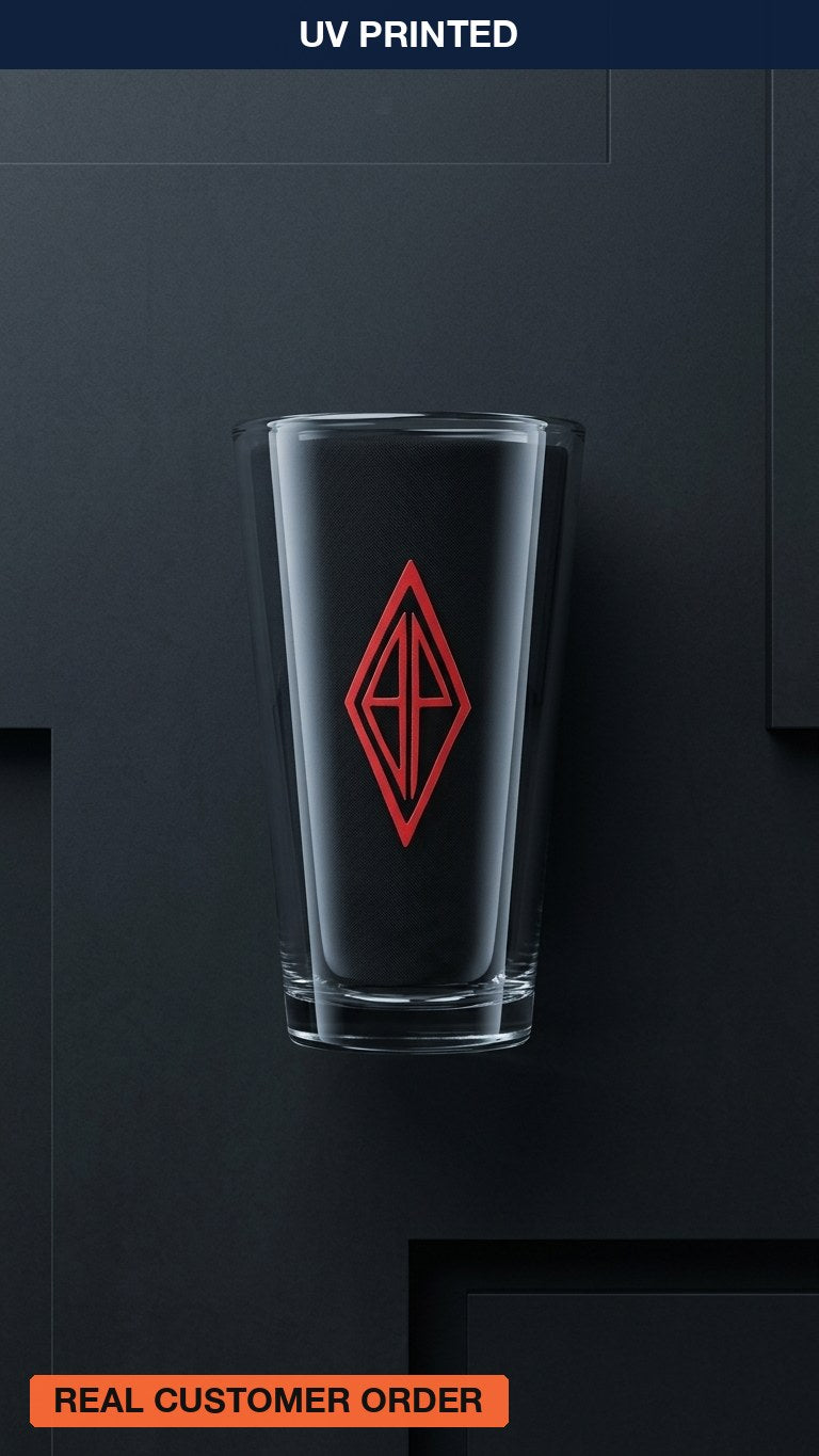 Pint glass printed with a red diamond monogram, a real Karved customer order
