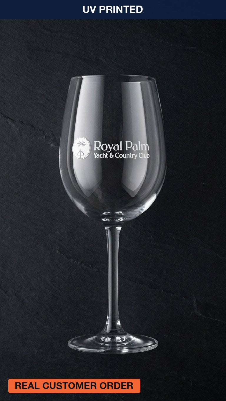 Wine glass printed with a white yacht club logo, a real Karved customer order